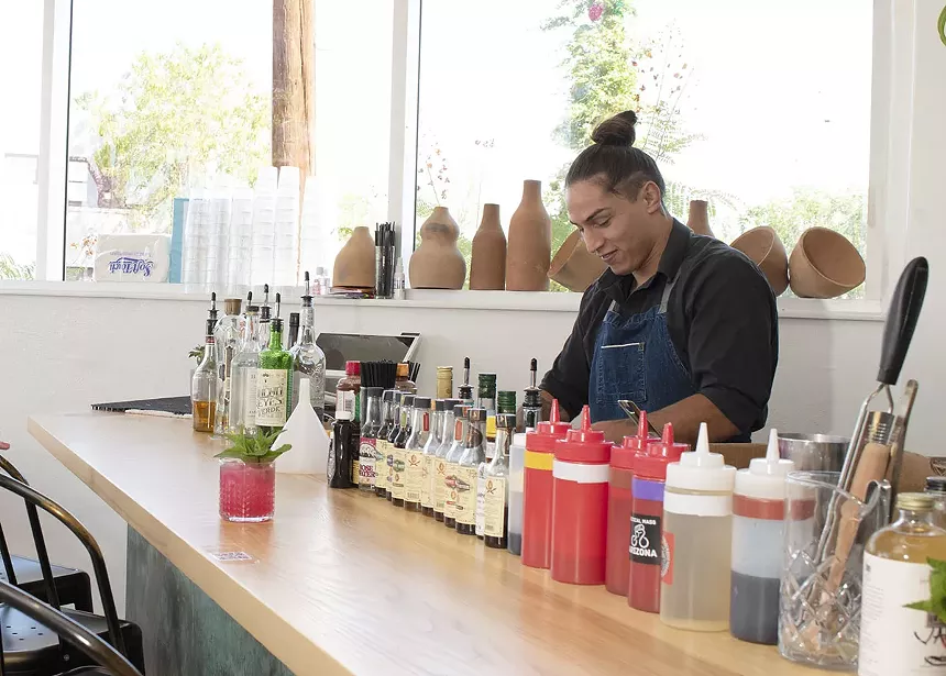 Adrian Galindo behind the bar at Bacanora.