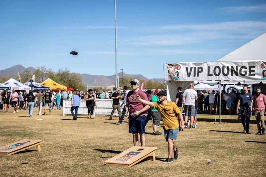 Playing cornhole at a beer festival.