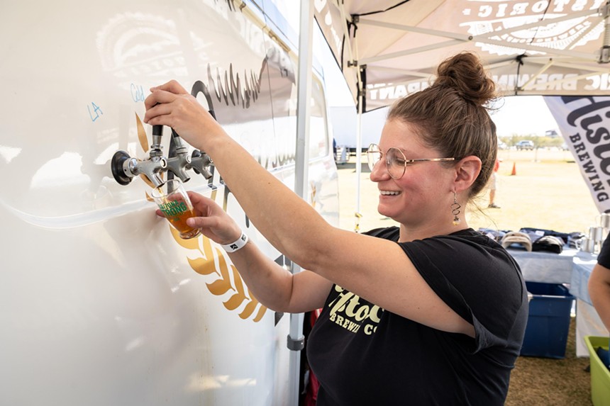 Pouring beer from a trailer.