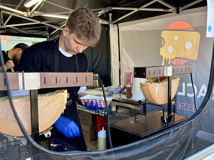 A tent serving raclette at FoodieLand.