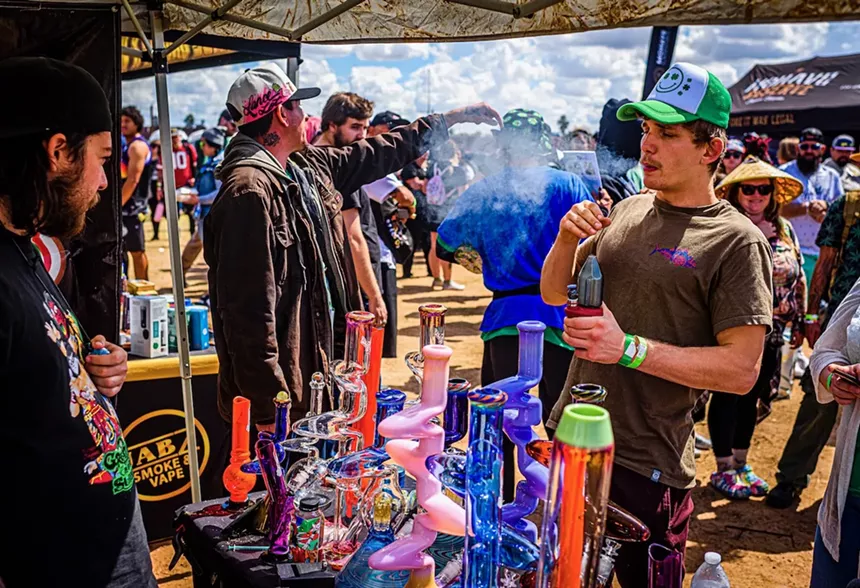 Man taking hit from an electric dab rig
