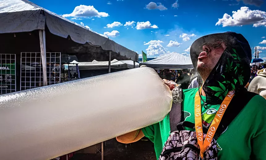 Man with inflatable bag of vaporized weed