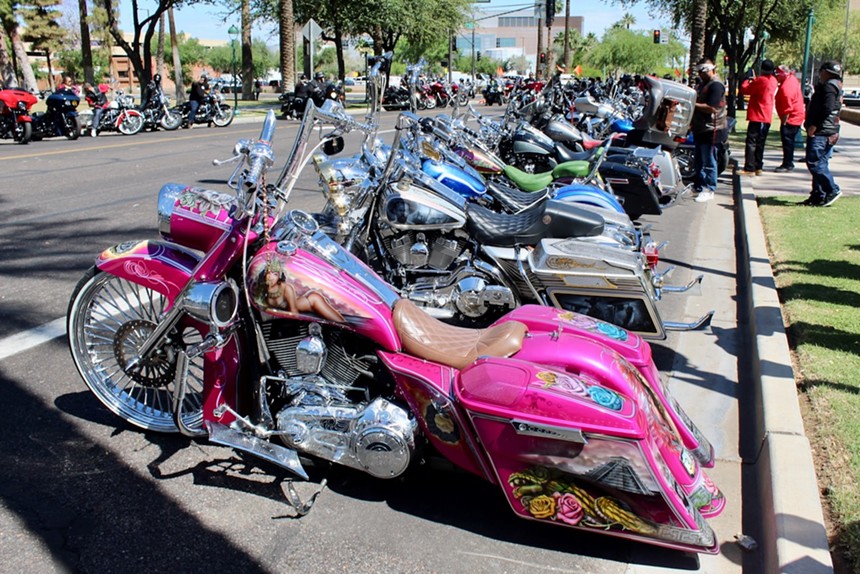 A colorful pink motorcycle.