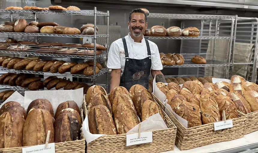 Baker Don Guerra with bread loaves.