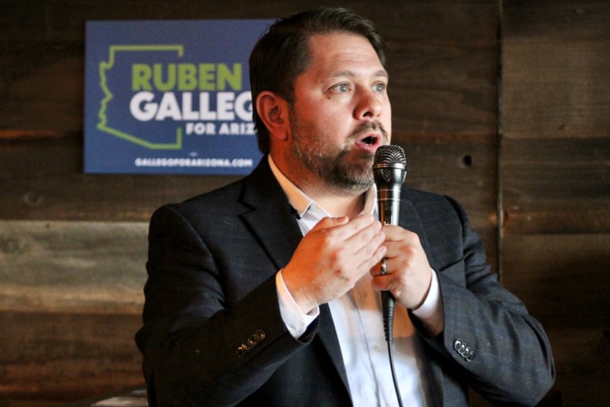Ruben Gallego with a microphone