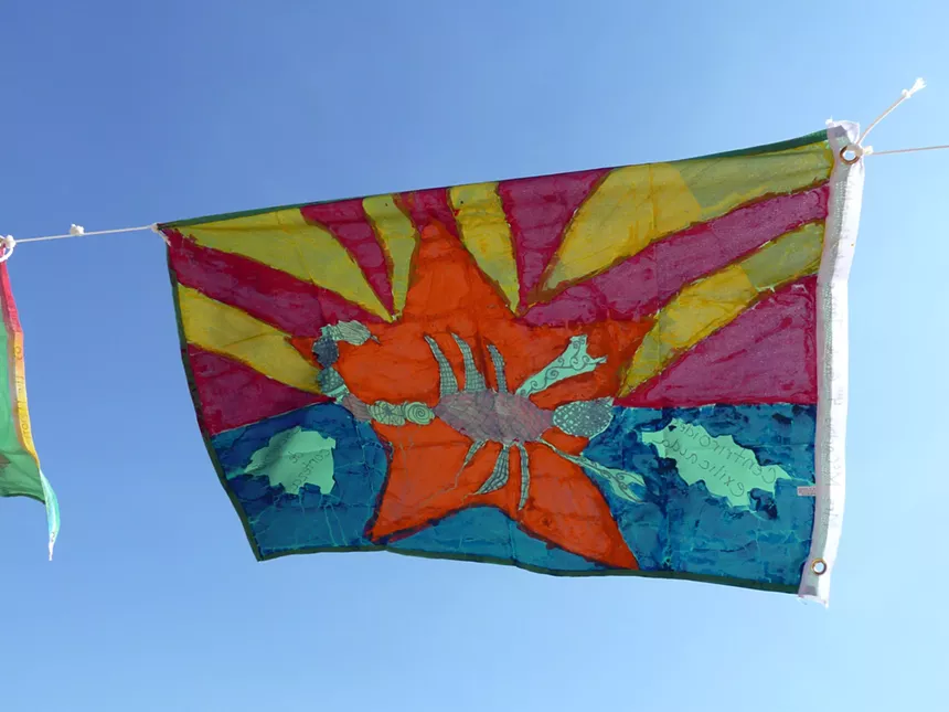 An Arizona flag with a scorpion on it