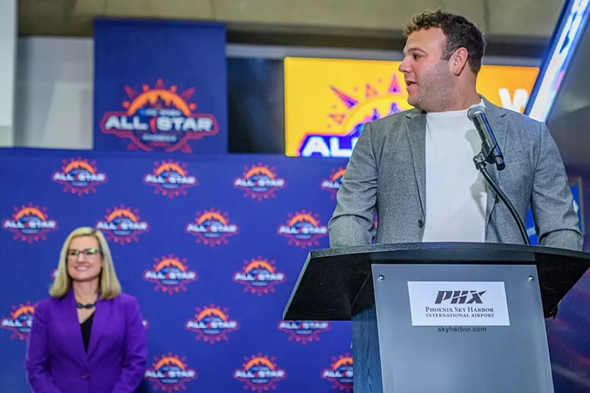 A man speaks at a podium