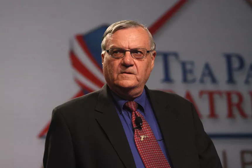 Joe Arpaio, in a suit and tie
