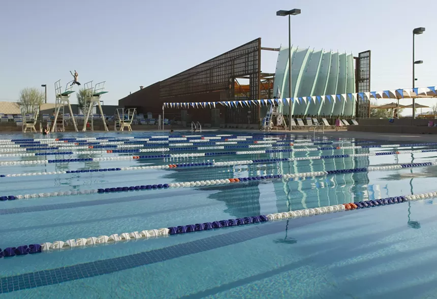 An empty pool meant for lane swimming.