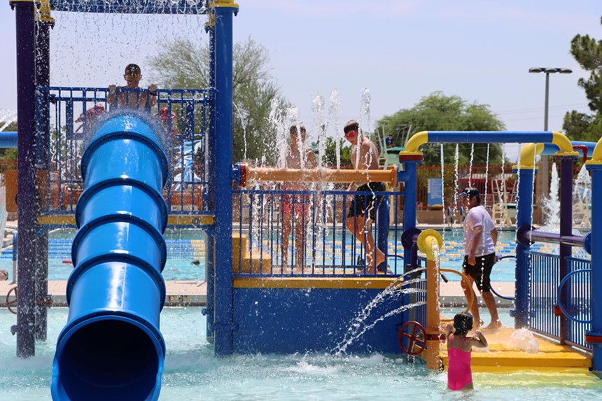 Children playing at a public pool.