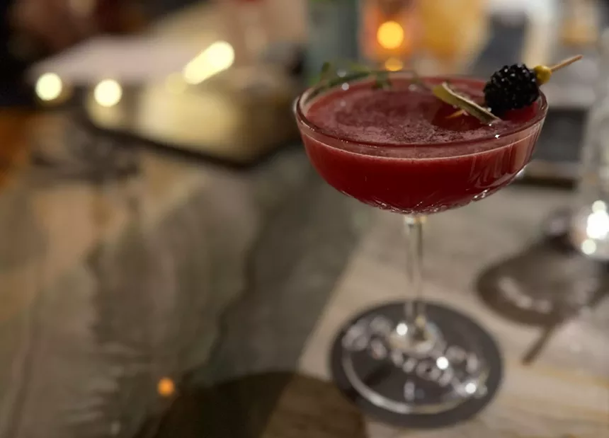 A cocktail in a coupe glass.