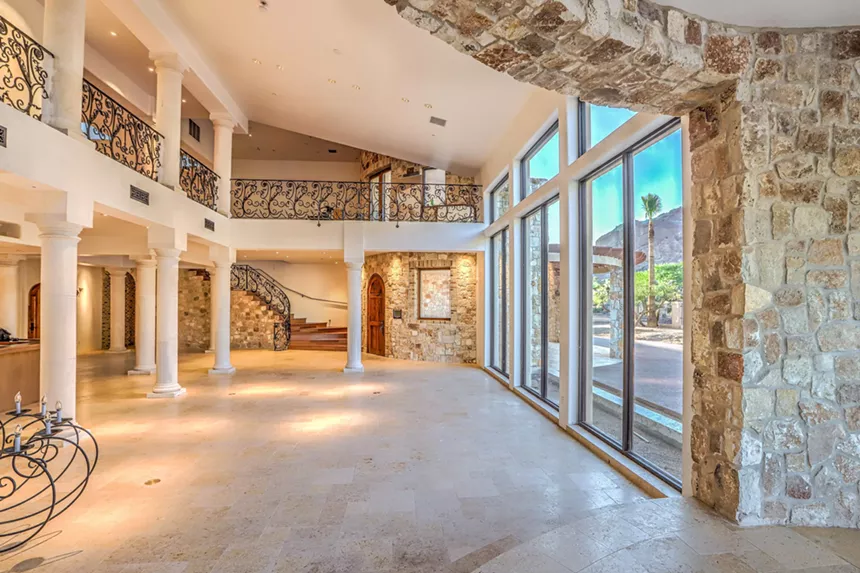 An empty living room in a mansion.