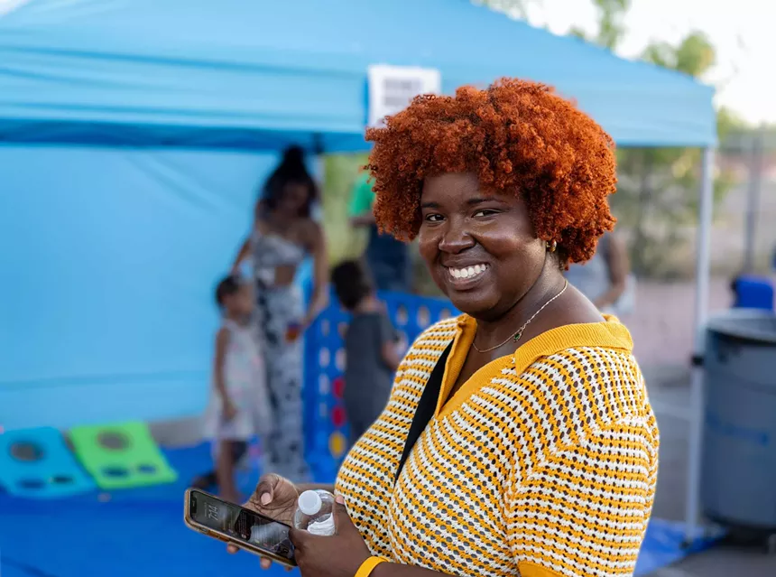 A Black woman with red hair.