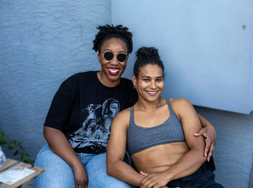 Two women smiling.