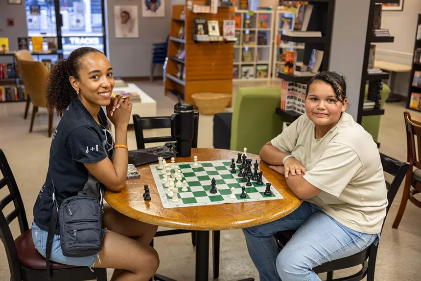 Two girls playing chess.