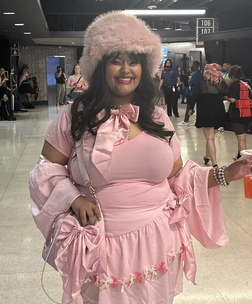 A woman in a pink outfit.