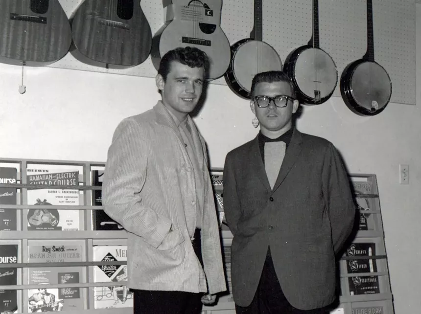 An old photo of two young men.
