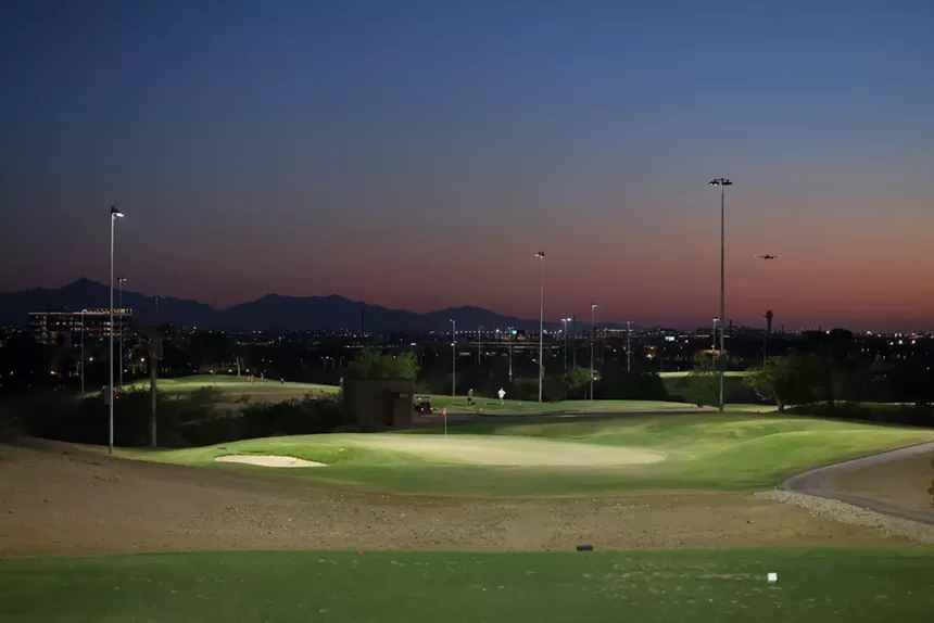 A golf course at sunset.