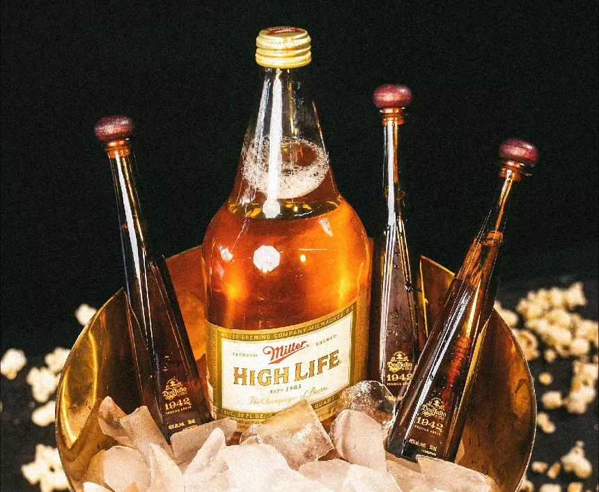 Ice bucket with beer and shooters.