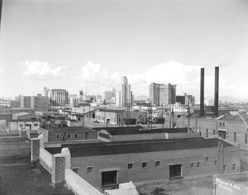 a 1933 photograph of downtown phoenix featuring the professional building and luhrs tower