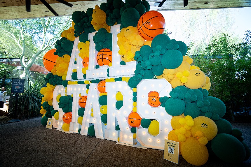 A big All Stars sign with green and yellow balloons