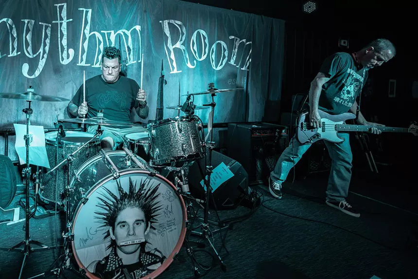 A band performing onstage.