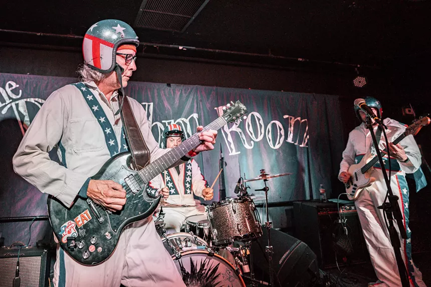 A band performing in costumes.
