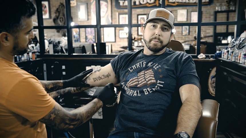 Eli Crane getting a tattoo