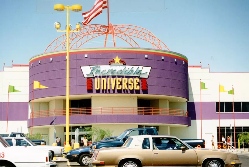 The parking lot and entrance of a big-box electronics store.