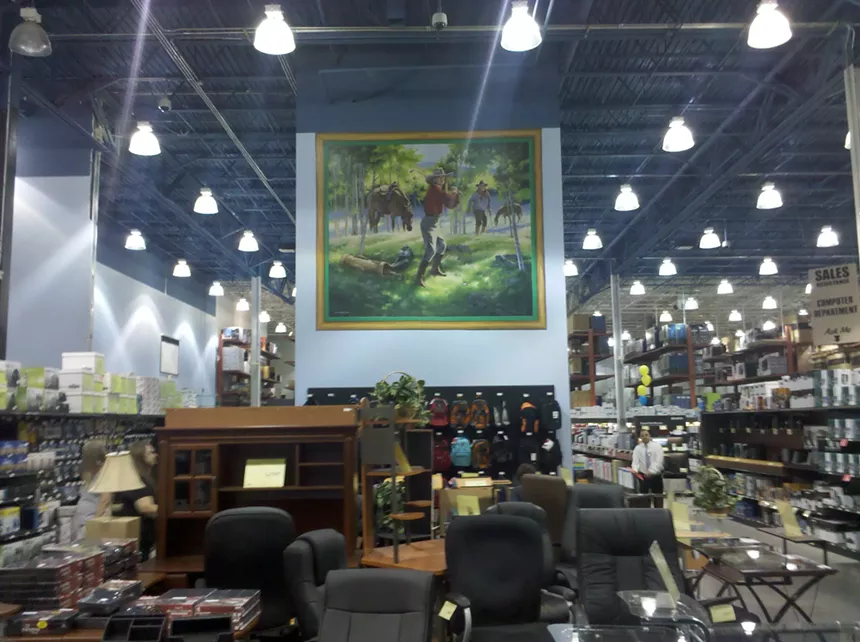 A selection of office furniture inside a retail store.