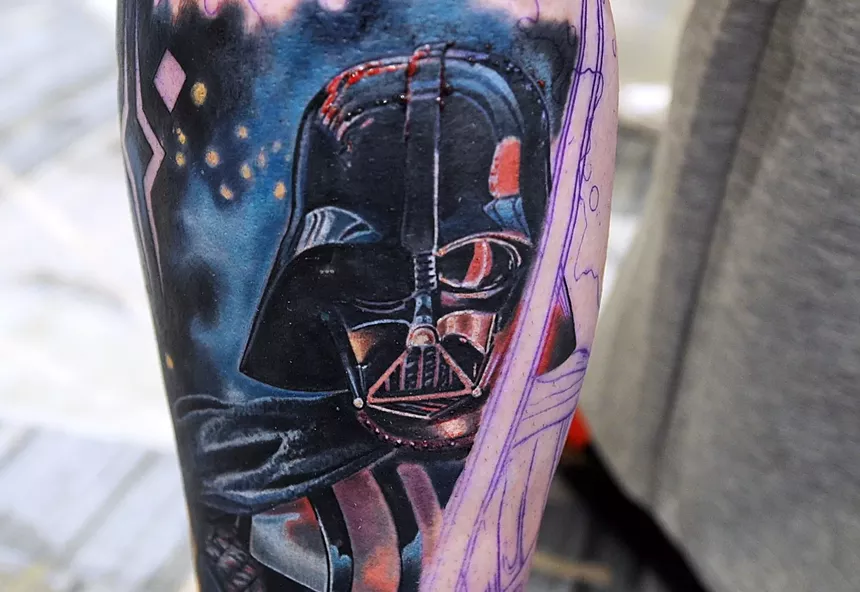 A Darth Vader tattoo on a leg.