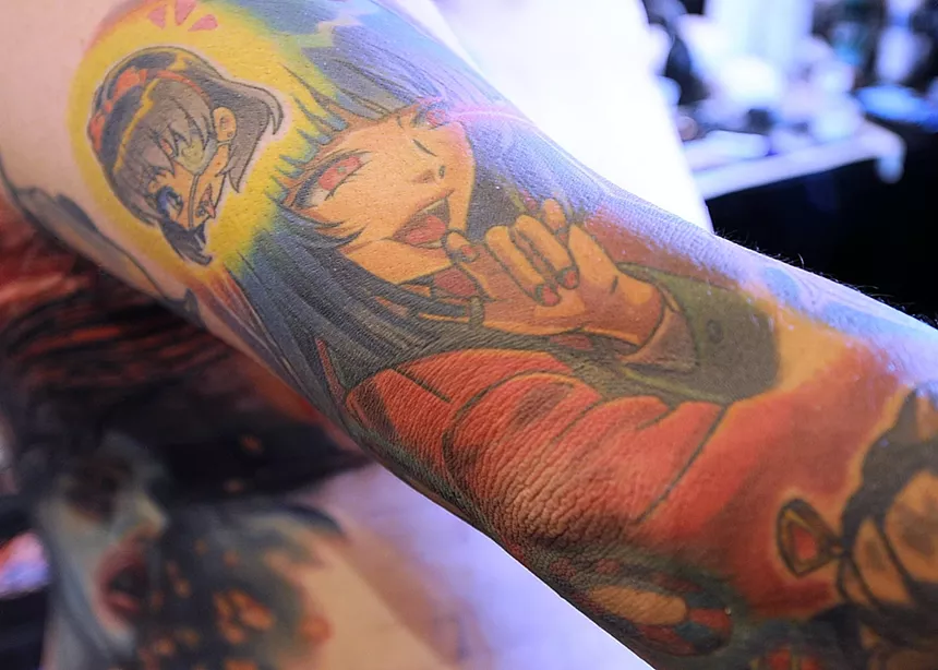 An anime-themed tattoo on an arm.