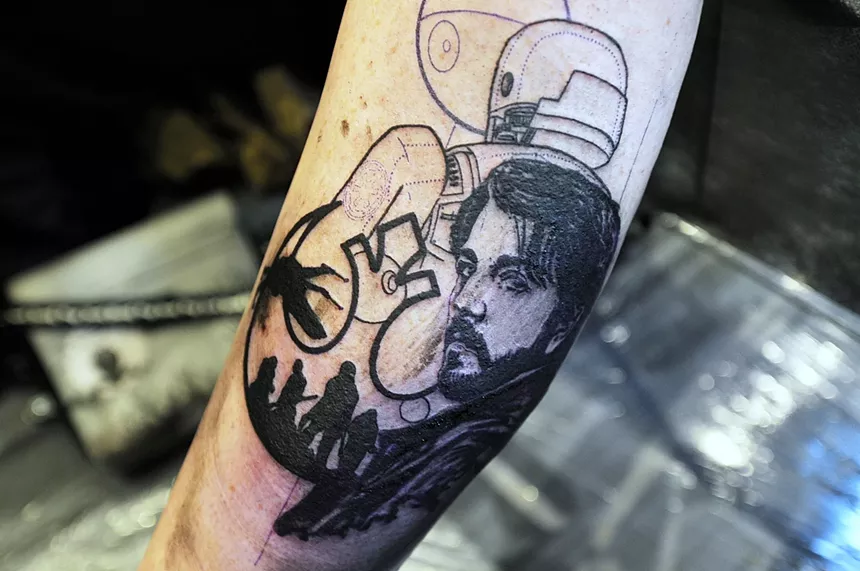 A "Star Wars" tattoo on a leg.