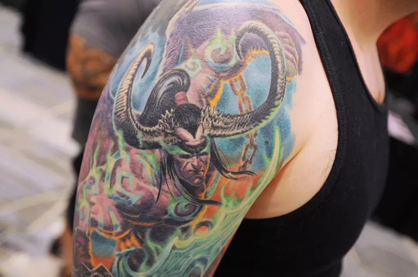A fantasy-themed tattoo on a shoulder.