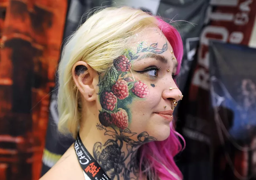 A woman with a face tattoo.