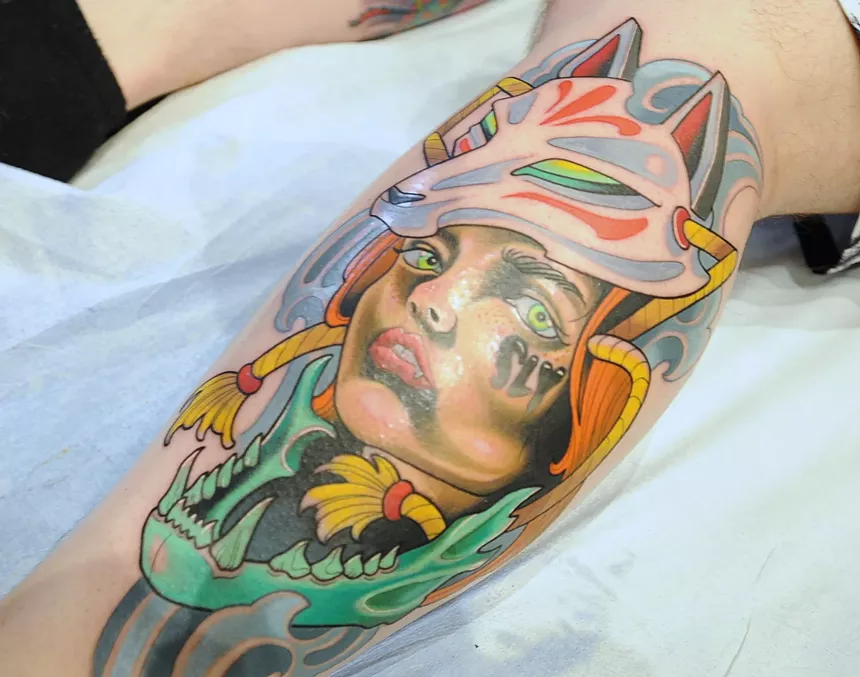 A colorful leg tattoo.