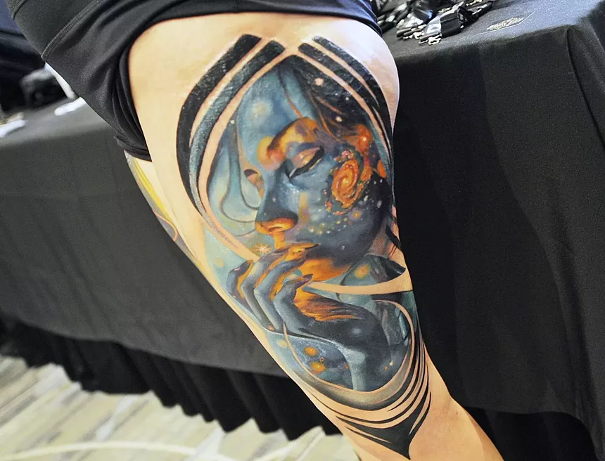 A tattoo on a person's leg.