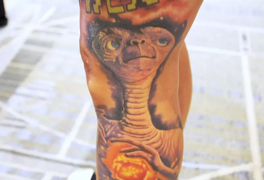 A tattoo on a person's leg.
