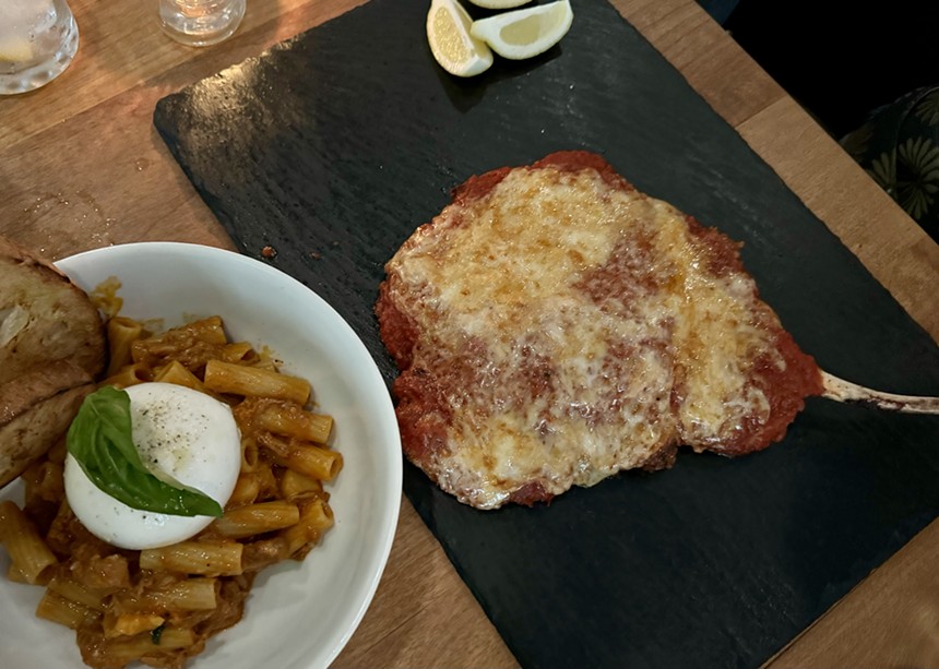 Plates of food from Pizzeria Virtu.