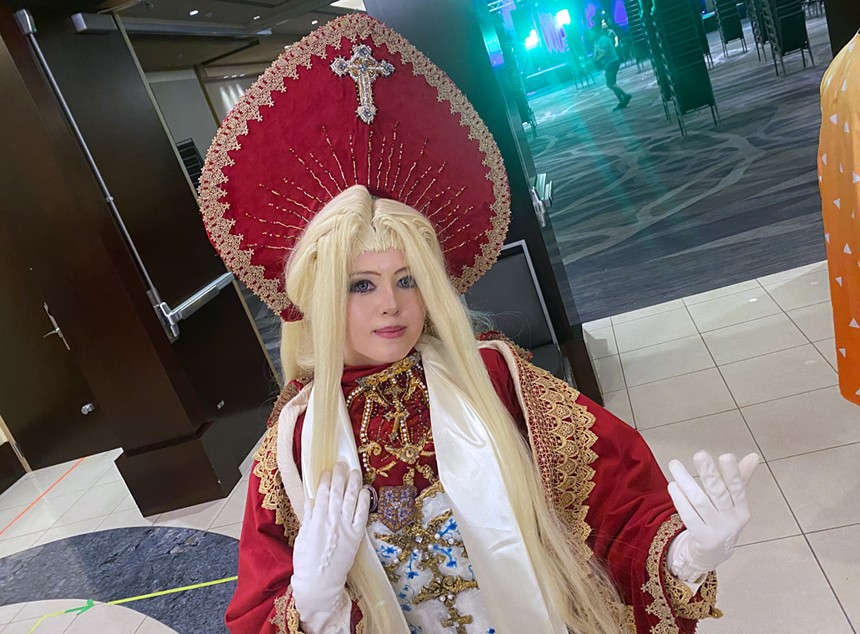 A person dressed as a religious character from an anime.