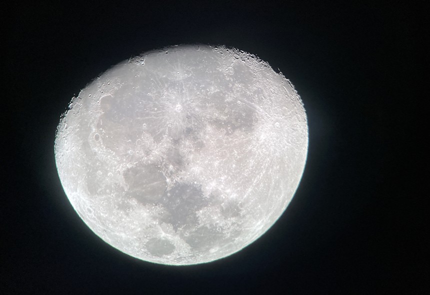 A photograph of the moon's surface at night.