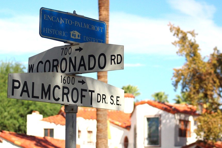 A historic home in the Encanto-Palmcroft neighborhood is seen behind the neighborhood's identifying sign on Sept. 19, 2024.