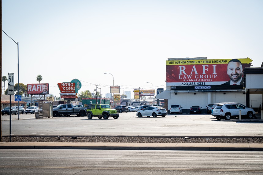 Two Rafi Law Group billboards on either side of the same street