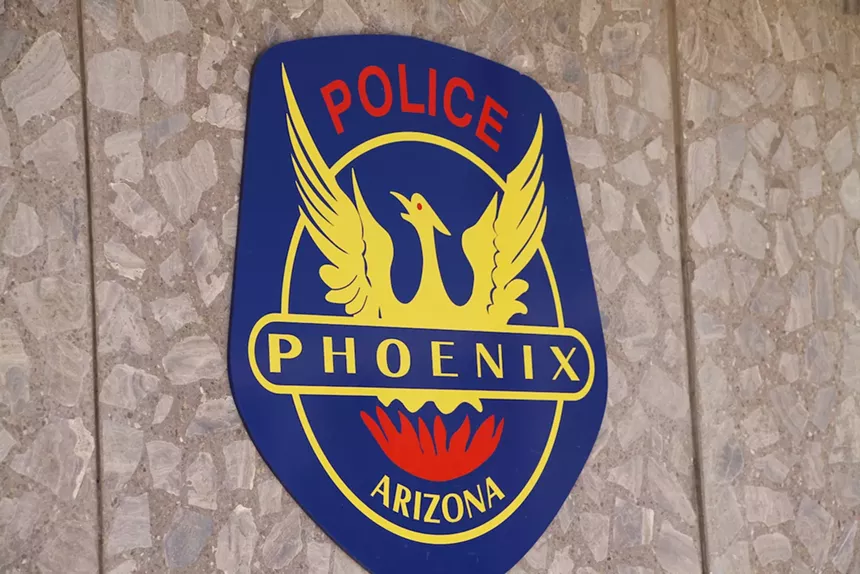a phoenix police seal on a wall
