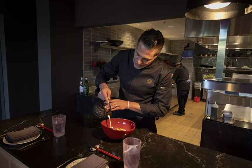 Chef Angelo Sosa pours broth for the Tuna Thai Jewel.