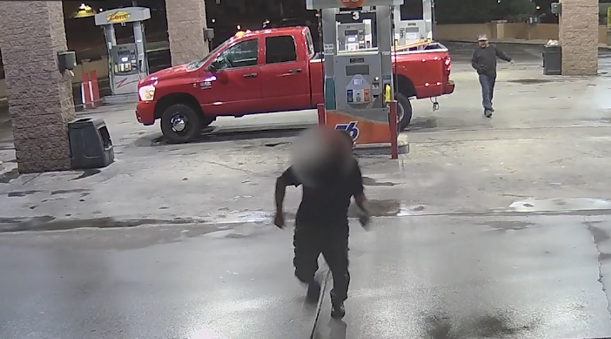 security cam footage showing one man, with his face blurred, running toward the camera while another has a hand on his waistband behind him