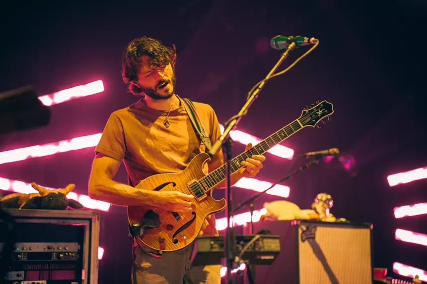 man plays guitar