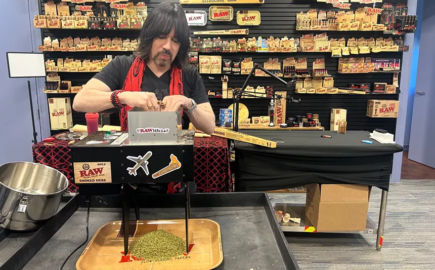 josh kesselman puts a pound of marijuana into a grinder