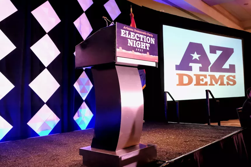 a podium and sign that say AZ Dems