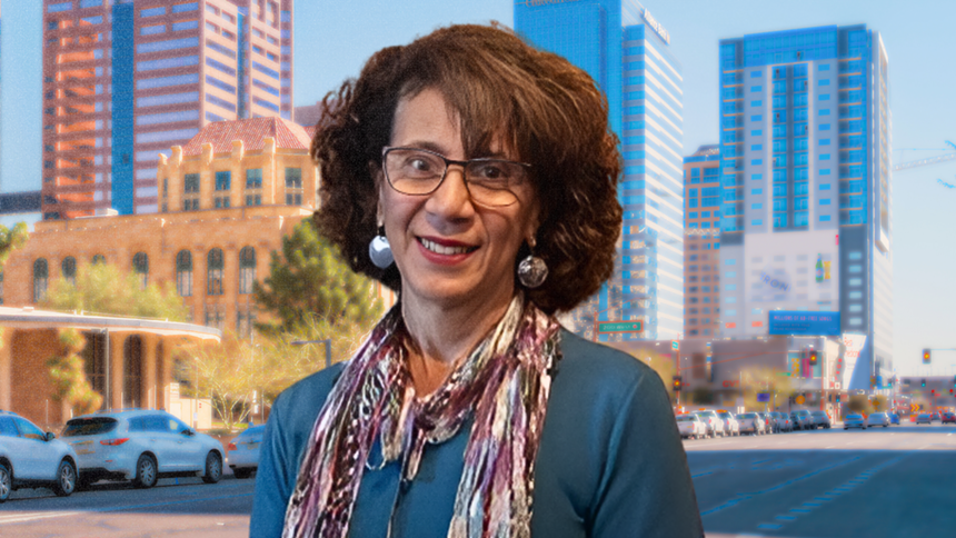 a woman with a scarf and glasses